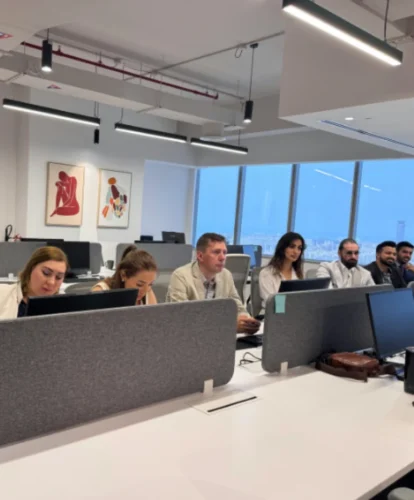 Russian team of Mencis International Ltd working in a modern corporate office environment