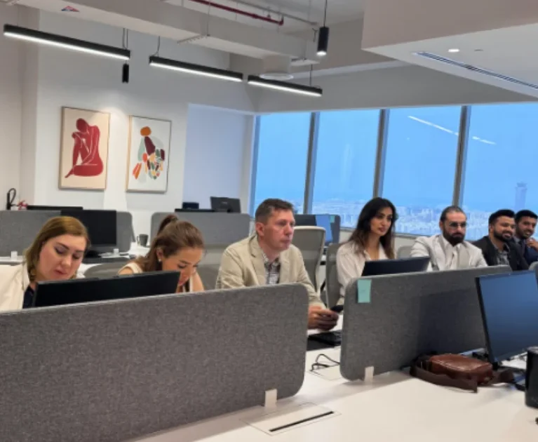 Russian team of Mencis International Ltd working in a modern corporate office environment