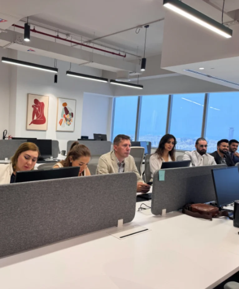 Russian team of Mencis International Ltd working in a modern corporate office environment